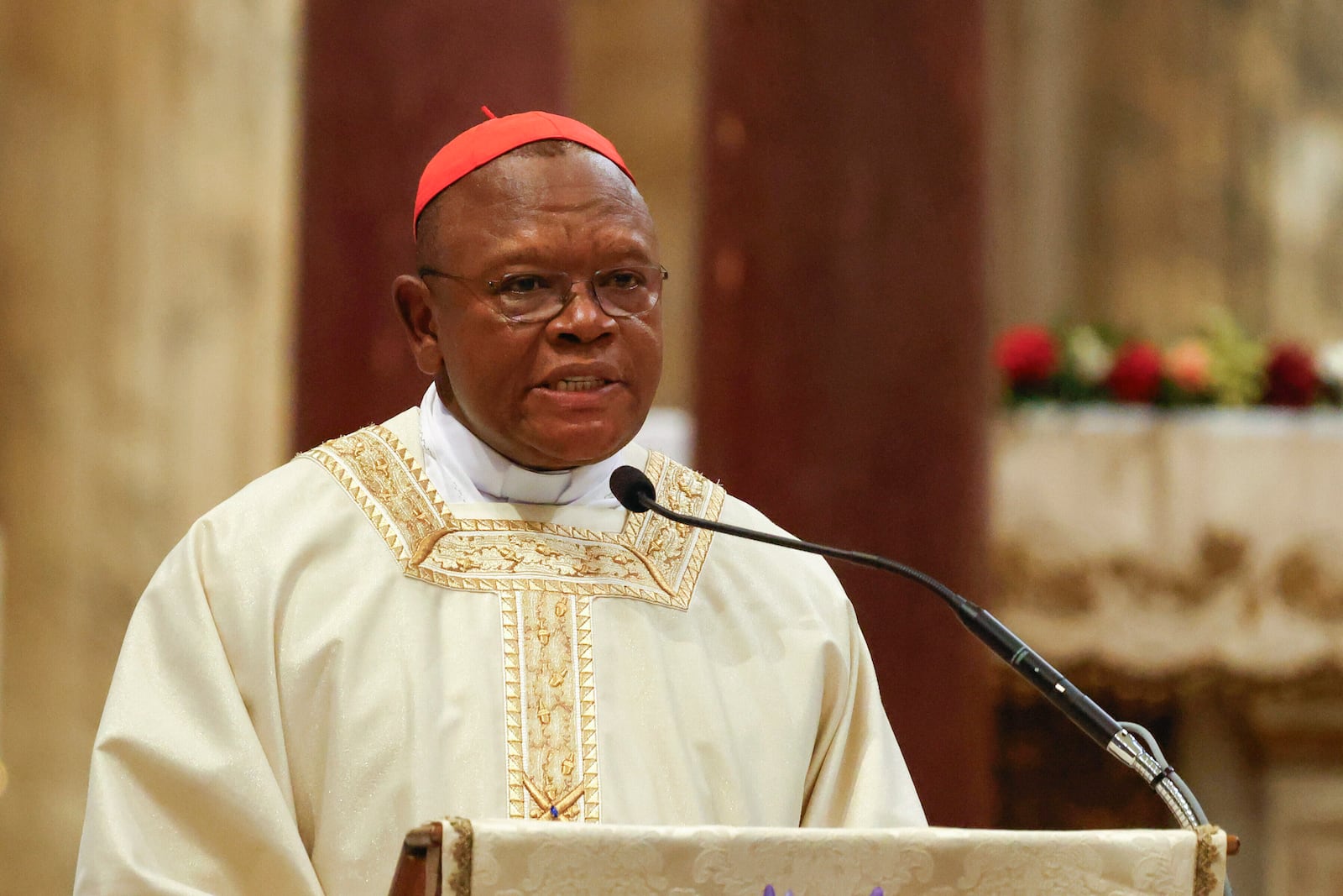 Cardinal Fridolin Ambongo Besungu speaks during a Mass for the beatification of Floribert Bwana Chui Bin Kositi, a Congolese man killed in 2007 for fighting corruption, in St. Paul Outside the Walls' Basilica, in Rome, Sunday, June 15, 2025. (AP Photo/Riccardo De Luca)
