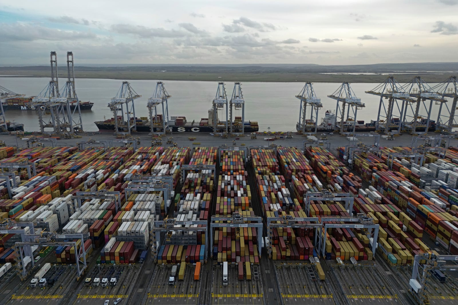 FILE - Shipping containers wait to be processed at London Gateway port, in Stanford-le-Hope, on the Thames estuary east of London, England, Wednesday, Feb. 5, 2025. (AP Photo, File)