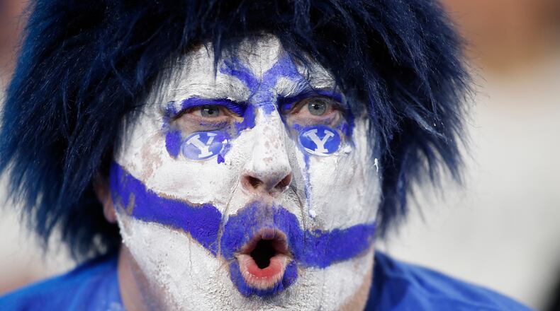 A BYU fan cheers during the second half of an NCAA college football game against TCU Saturday, Nov. 15, 2025, in Provo, Utah. (AP Photo/George Frey)