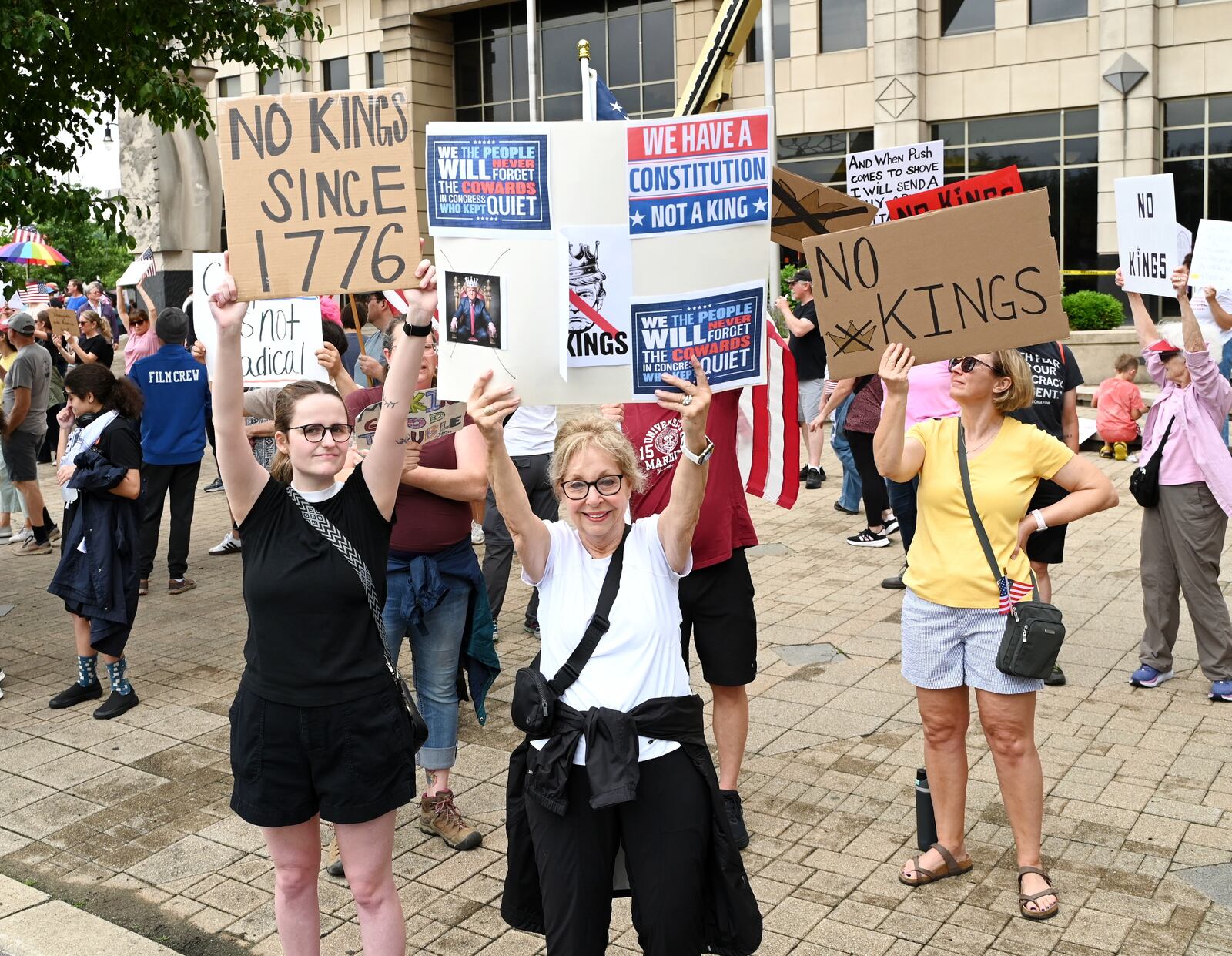 More than 300 people from the region ascended onto One Renaissance Center at the corner of Martin Luther King Jr. Boulevard and High Street in Hamilton to protest President Donald Trump on his policies and what many called his "political overreach." On this day, Saturday, June 14, 2025, is the president's 79th birthday and a military parade he wanted organized. MICHAEL D. PITMAN/STAFF