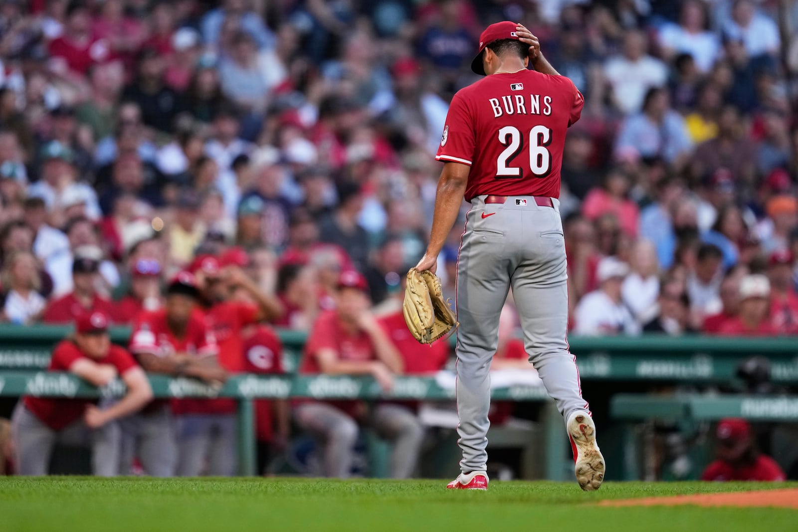 Cincinnati Reds pitcher Chase Burns heads to the dugout after being pulled during the first inning of a baseball game against the Boston Red Sox at Fenway Park, Monday, June 30, 2025, in Boston. (AP Photo/Charles Krupa)
