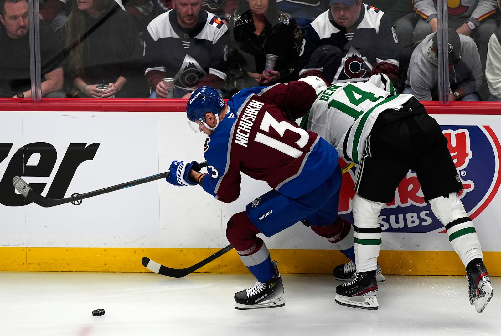 Colorado Avalanche right wing Valeri Nichushkin, right, drives past Dallas Stars left wing Jamie Benn in the first period of Game 3 of an NHL hockey first-round playoff series Wednesday, April 23, 2025, in Denver. (AP Photo/David Zalubowski)