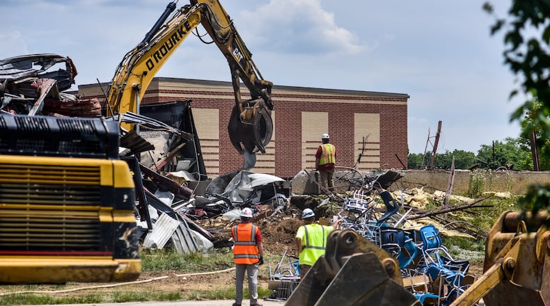 The old Carlisle High School is being demolished to make way for the new school being built behind it Tuesday, June 16, 2020. A new school building serving pre-K through 12th-grade is being built on the property and is expected to open for the 2020-2021 school year. NICK GRAHAM / STAFF