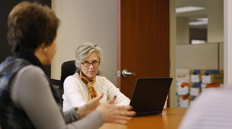 Butler County Treasurer Nancy Nix leads a meeting with office crew about tax information Tuesday, Jan. 24, 2023 at her office in Hamilton. NICK GRAHAM/STAFF