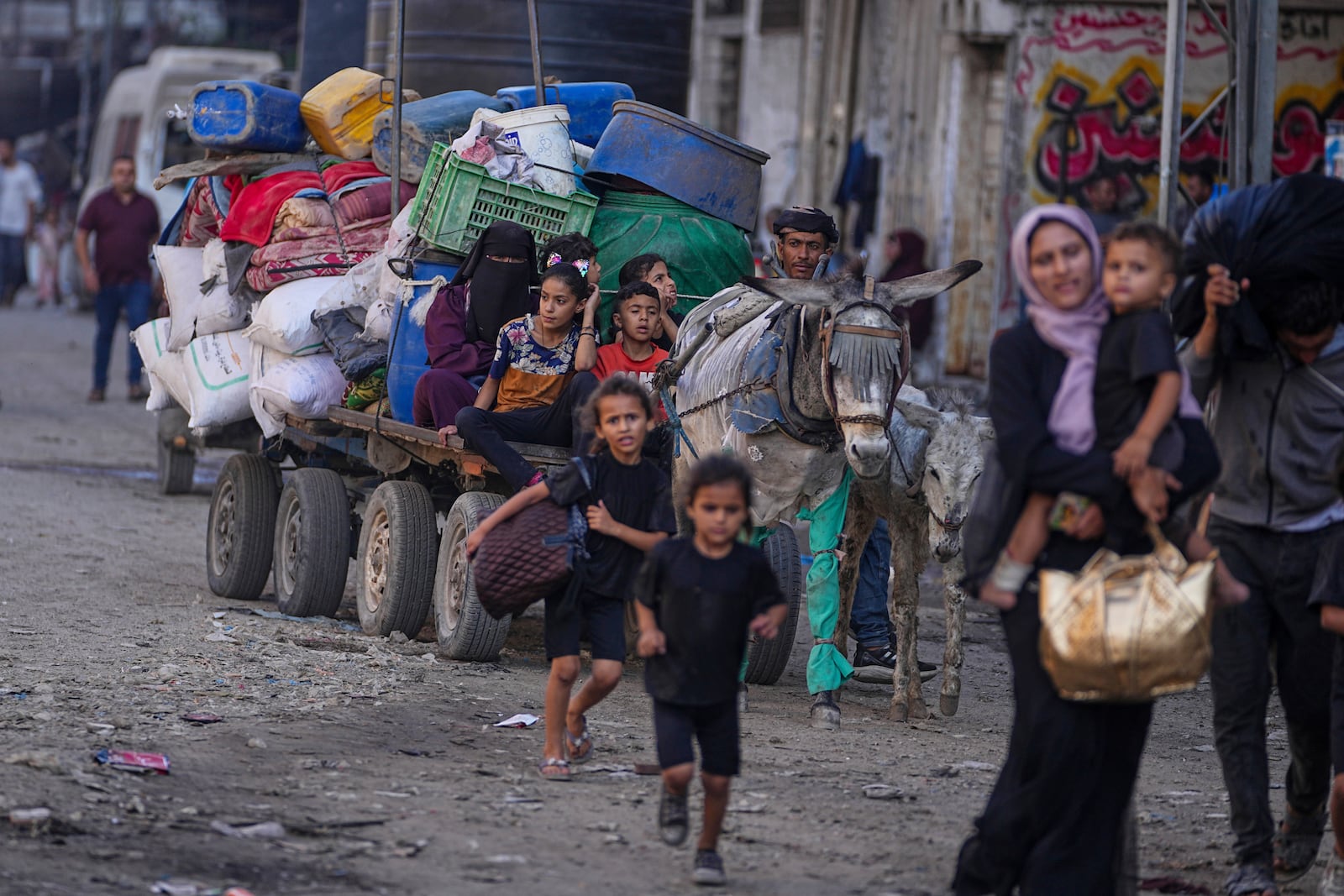 Displaced Palestinians flee Jabalia after the Israeli army issued evacuation orders in Gaza City, June 29, 2025. (AP Photo/Jehad Alshrafi)