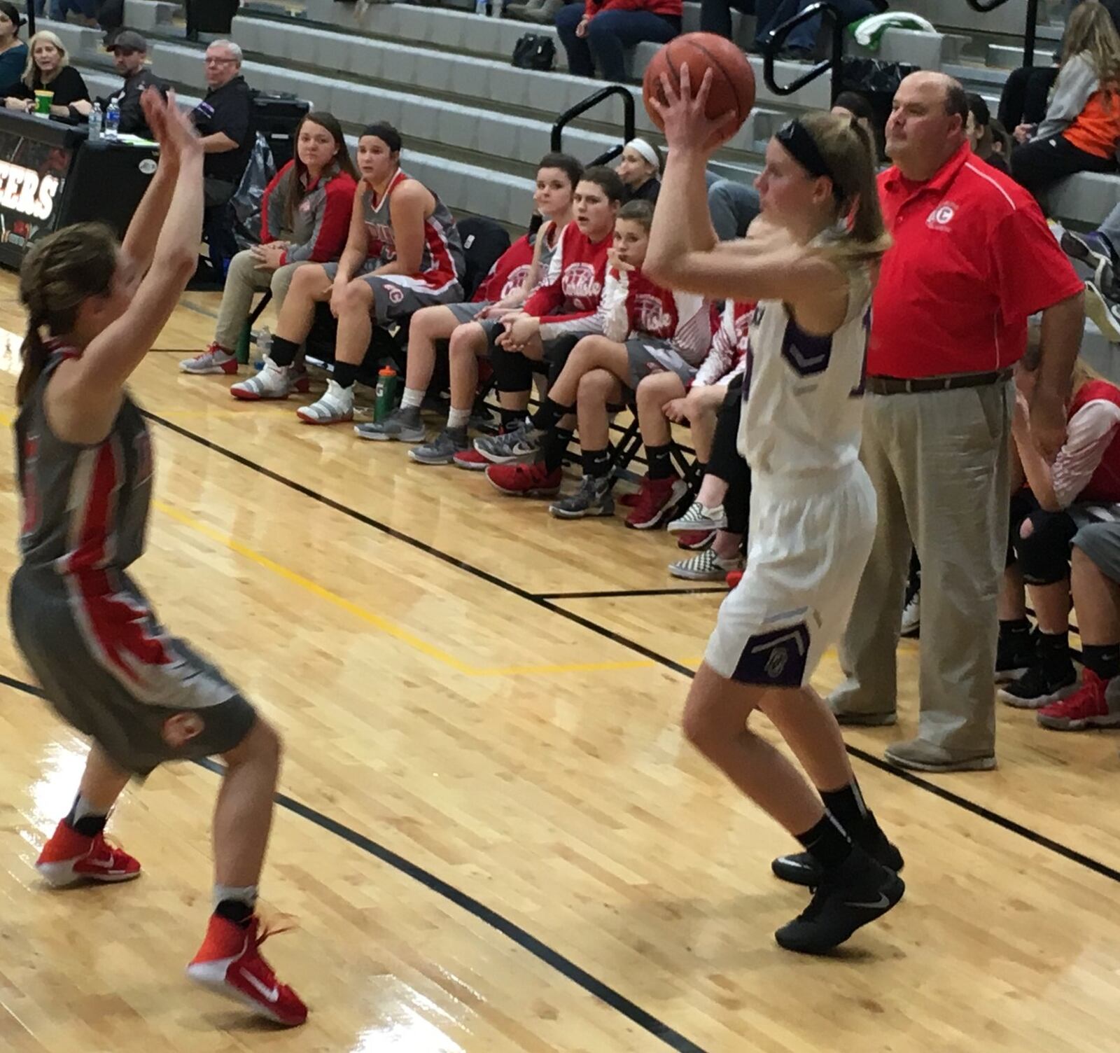 Carlisle’s Maleah Cotton pressures Dayton Christian’s Kiana Klein as CHS coach Randy Glover watches during Wednesday night’s Division III sectional semifinal at Covington. RICK CASSANO/STAFF