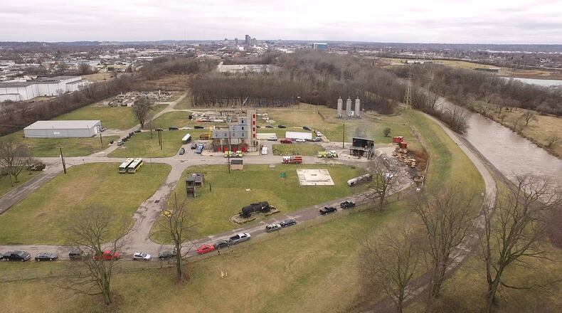 Dayton confronts two Mad River well field sites that face contamination threats from contaminants in firefighting foam. One is at the city’s fire training facility site off Springfield Street shown here, and the other is Wright-Patterson Air Force Base, city officials say. The Mad River, right, flows past the Dayton fire training facility. TY GREENLEES / STAFF