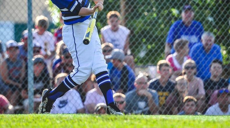 Hamilton West Side Little League’s Davis Avery hits one of his two home runs during the District 9 Little League tournament championship game against Lebanon at the West Side complex in Hamilton. NICK GRAHAM/STAFF