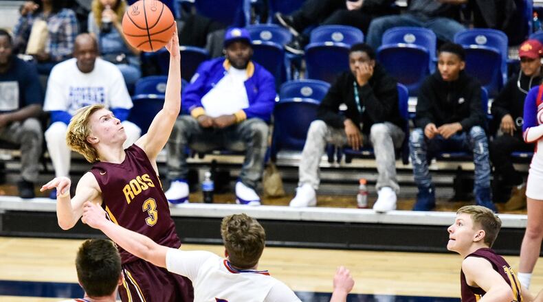 Dylan Zimmerman of Ross grabs a pass over Clinton-Massie’s Daulton Wolfe during their Division II sectional game Feb. 23, 2018, at Fairmont’s Trent Arena in Kettering. Clinton-Massie won 58-45. NICK GRAHAM/STAFF