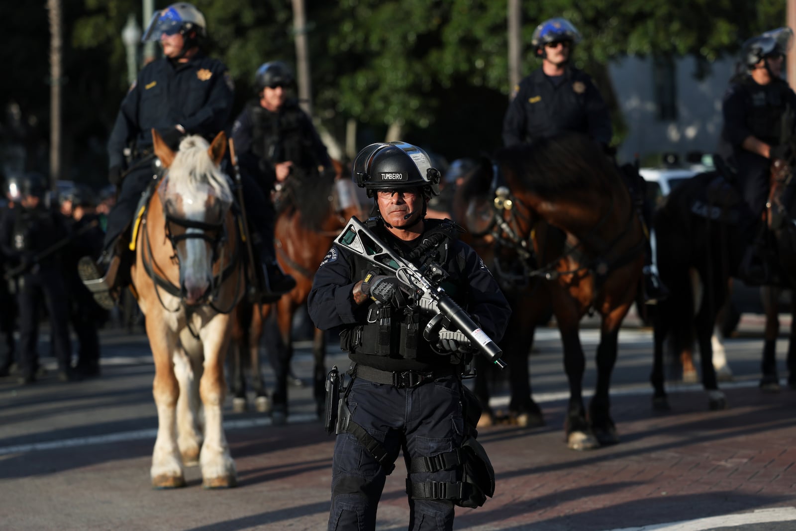 A Los Angeles Metro police officer stands guard during a protest on Wednesday, June 11, 2025, in Los Angeles. (AP Photo/Ethan Swope)