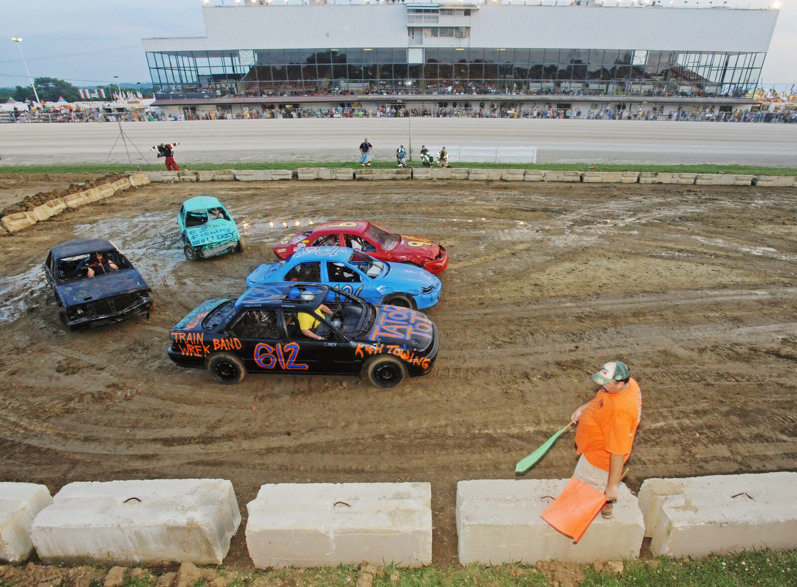 Vehicles drive around in a figure eight on Wednesday, July 21, 2010, during the demolition derby at the Warren County Fair in Lebanon. Staff file photo by Apryl Pilolli