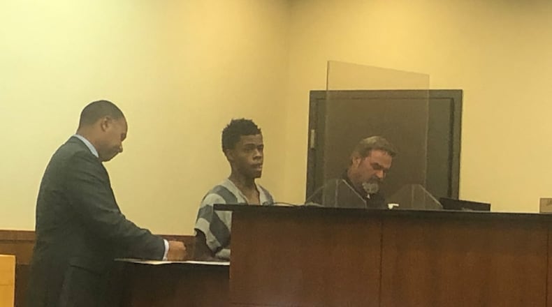 Denzel Fuller, 22, of Middletown, appears with his attorney Lawrence Hawkins, Wednesday morning in Middletown Municipal Court. His preliminary hearing was continued until 9 a.m. Friday. RICK McCRABB/STAFF