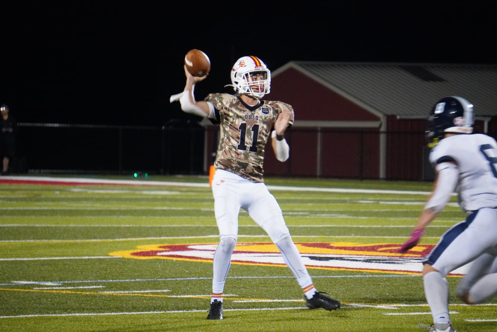 Fenwick quarterback McCaffrey Holcomb throws a pass against Edgewood on Thursday night at Yeager Field. CHRIS VOGT / CONTRIBUTED