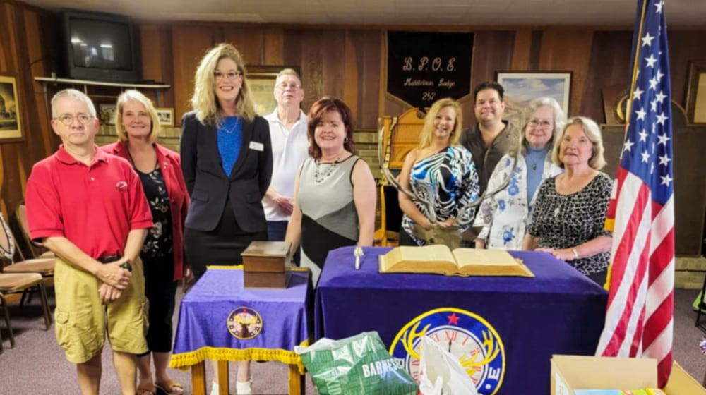 In 2021, the Middletown Elks Lodge #257 purchased books and board games for the Blue Star Families chapter that serves Southwest Ohio. The books and board games are given to local military families. Pictured left to right are Bret Frank, Karen Frank, Geri Maples, PhD/Chapter Director of Blue Star Families, John Ramsey, Melodie Rickard, Angie Whitt Sberna, Jim Sberna, Linda Jordan and Connie Back. Contributed.