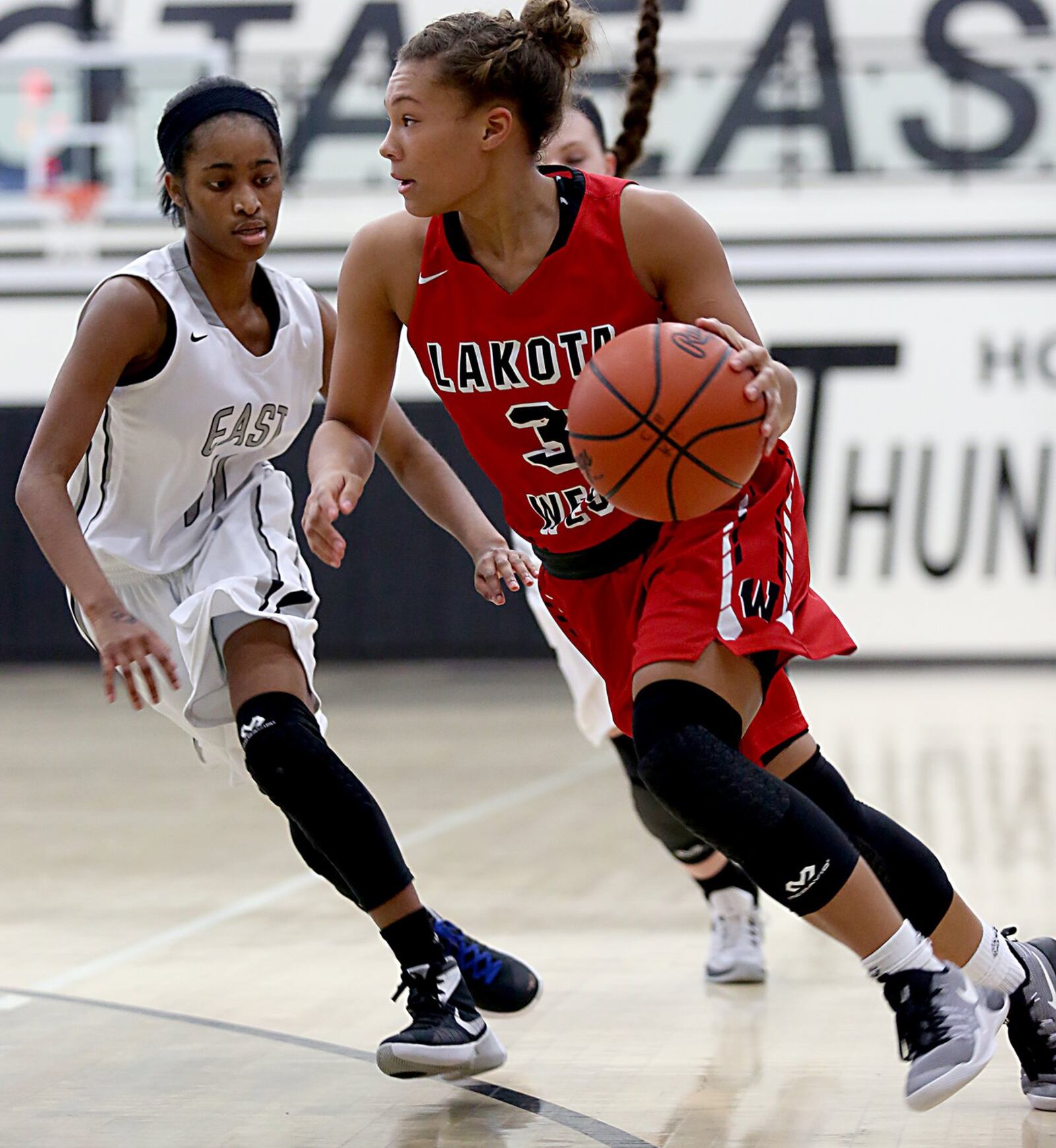 Lakota West guard Juliauna Howard is covered by Lakota East guard Shaniyah Reese during their game Wednesday night in Liberty Township. CONTRIBUTED PHOTO BY E.L. HUBBARD