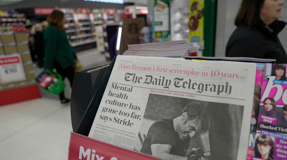 FILE -The Daily Telegraph newspaper with the front page of French President Emanuel Macron is seen at a supermarket in London, March 21, 2024. (AP Photo/Kin Cheung, File)
