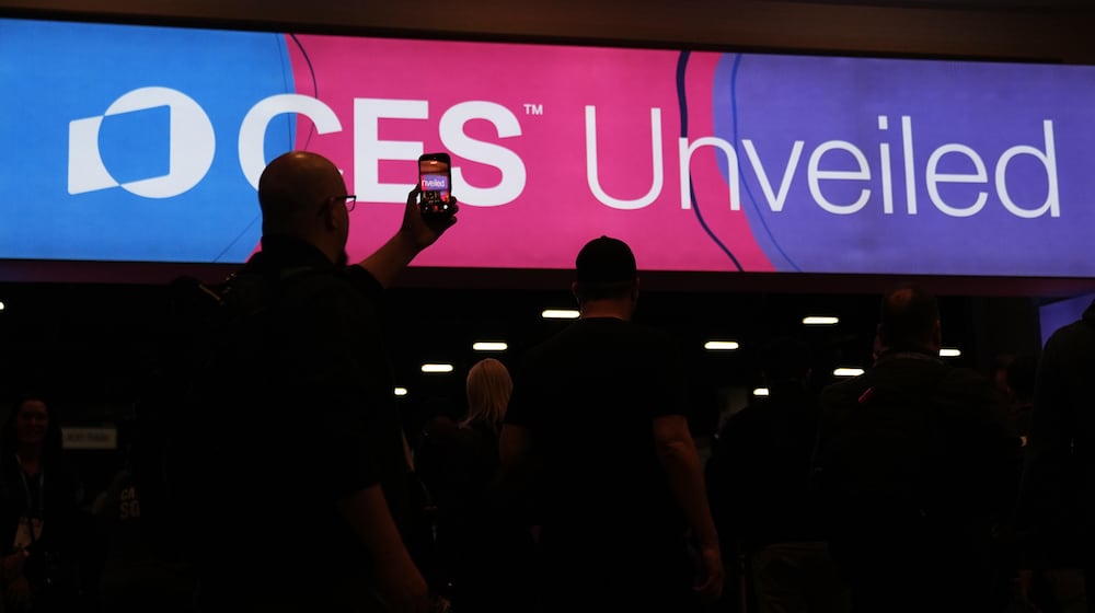 People arrive at the CES Unveiled tech show Sunday, Jan. 4, 2026, in Las Vegas. (AP Photo/Abbie Parr)