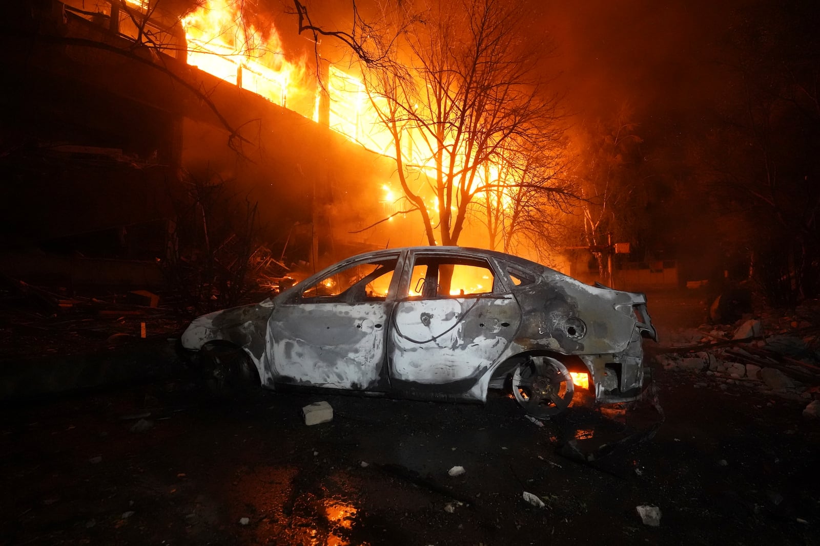Firefighters tackle a blaze after a Russian attack that hit a residential building in Kharkiv, Ukraine, Wednesday, June 11, 2025. (AP Photo/Andrii Marienko)