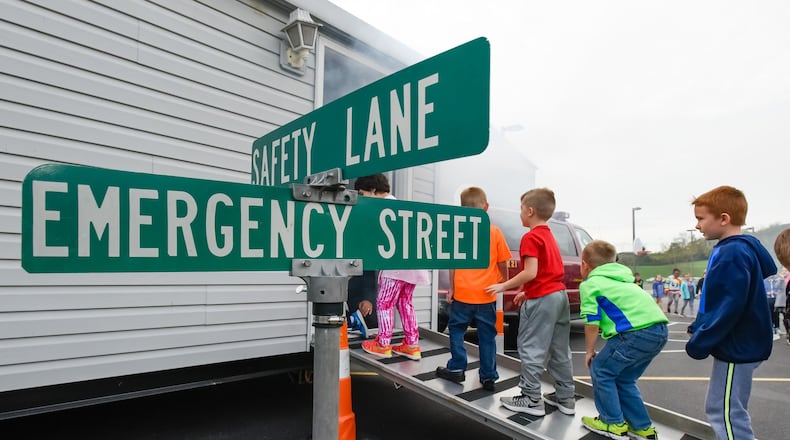 Hamilton firefighters gave a fire safety presentation to students at Brookwood Elementary on Wednesday, Oct. 26. NICK GRAHAM/STAFF