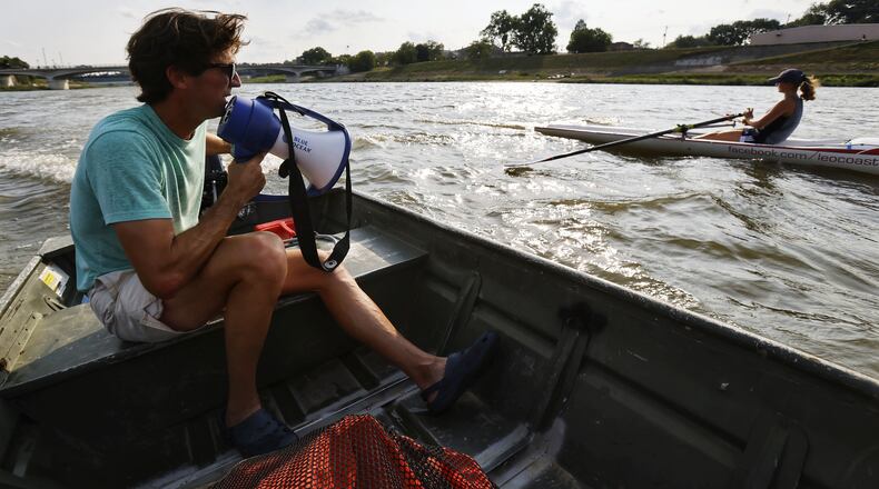 Marc Oria, head coach of Great Miami Crew, communicates with rower Cassidy Norton during practice Wednesday, Aug. 11, 2021 on the Great Miami River in Hamilton. Oria, Norton and a few others will be travelling to Barcelona, Spain to train for a world competition in Portugal. Norton will compete as a single in the coastal rowing boat competition. NICK GRAHAM / STAFF