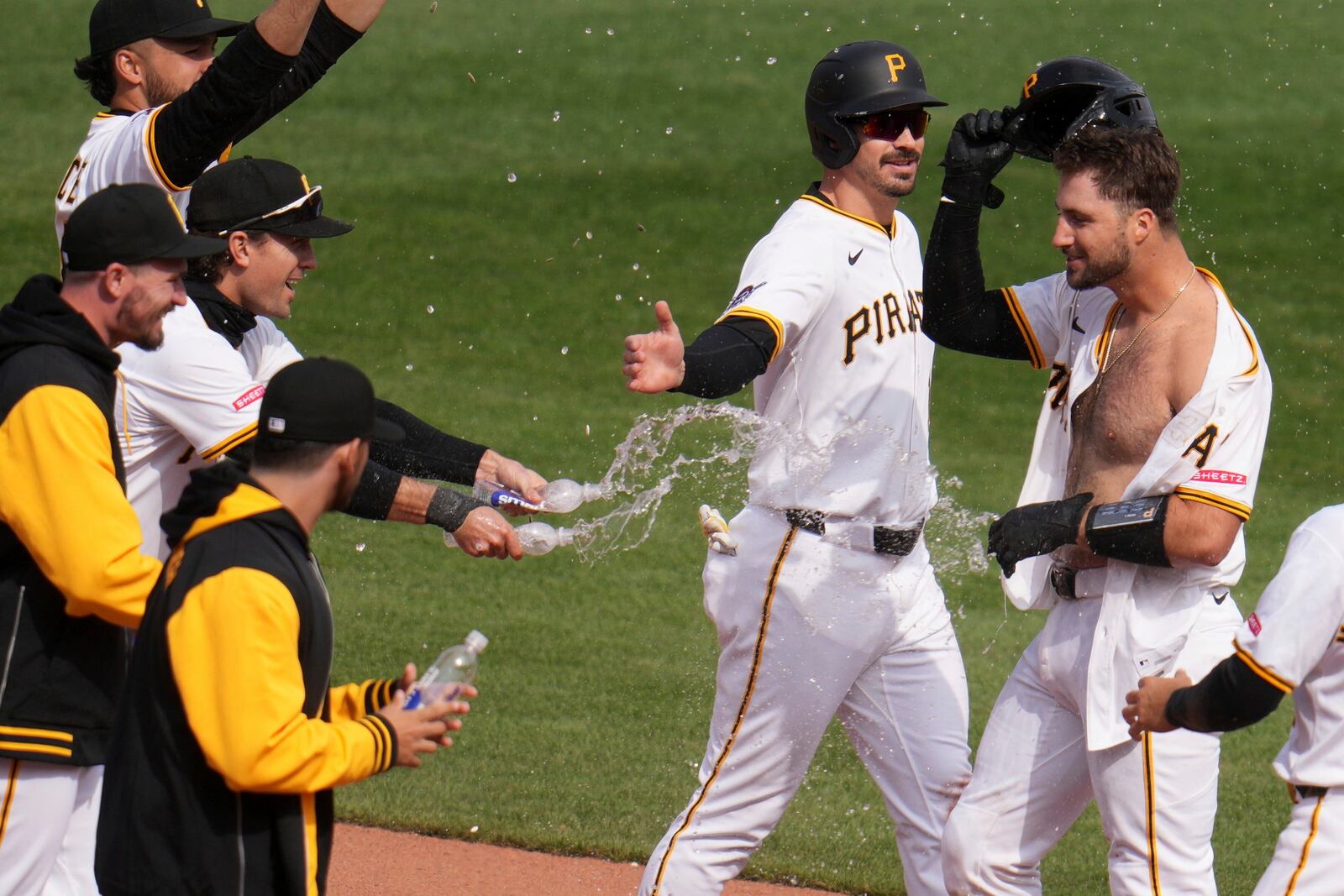 Pittsburgh Pirates' Joey Bart, right, celebrates with teammates after driving in the game-winning run in the 13th inning of a baseball game against the St. Louis Cardinals in Pittsburgh, Wednesday, April 9, 2025. (AP Photo/Gene J. Puskar)