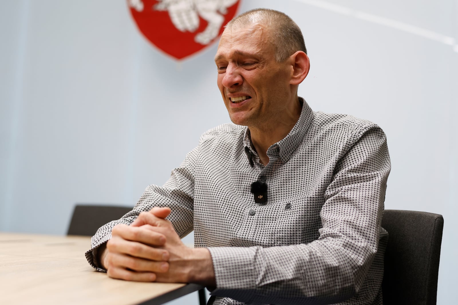 Syarhei Tsikhanouski, a Belarusian opposition activist released from a prison by Belarusian authorities, cries during an interview with the Associated Press in Vilnius, Lithuania, Sunday, June 22, 2025. (AP Photo/Mindaugas Kulbis)