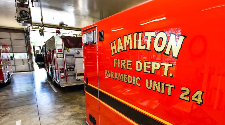 A Hamilton fire ambulance awaits its next run. The city’s fire chief says the number of emergency medical runs has been up recently because of heat-related illnesses. NICK GRAHAM/STAFF