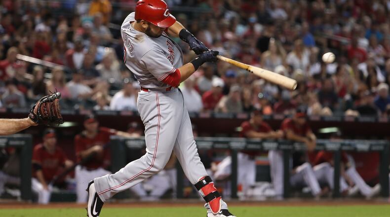 The deck was stacked against the Reds before the first pitch against the Nationals Monday, but Eugenio Suarez  homered off Washington starter Stephen Strasburg in the second inning. Here he is batting against the Diamondbacks July 9th in Phoenix.