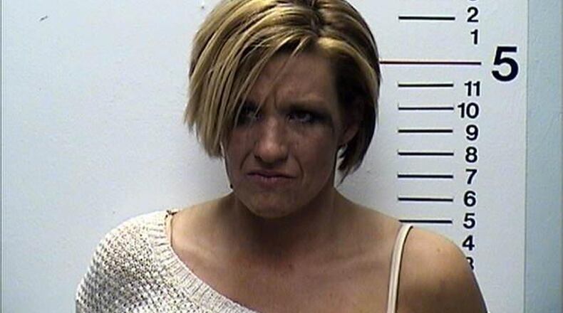 Carmen Statzer, 35, of Monroe, was charged with OVI and driving under suspension