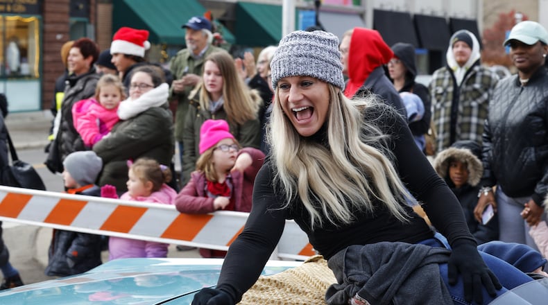 Kayla Harrison served as grand marshal for the Santa Parade kicking off Middletown Holiday Whopla events Saturday, Nov. 27, 2021 in downtown Middletown. NICK GRAHAM / STAFF