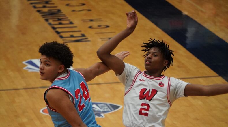 Lakota West's Joshua Tyson (2) puts up a shot over Fairmont's Jayden McGraw (24) at the 22nd Annual The Beacon Orthopedics Flyin’ to the Hoop Invitational on Monday night at Trent Arena. Chris Vogt/CONTRIBUTED