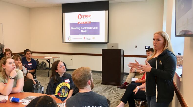 Leah Matthews of Cincinnati recounted to the more than 50 Miami University students attending the school’s first “Stop The Bleed” class this week the bloody chaos she witnessed as a survivor of the 2017 Las Vegas country music concert massacre where a gunman killed 58 and wounded hundreds shooting from the 32nd floor of a nearby hotel.(Photo by Michael D. Clark/Journal-News)