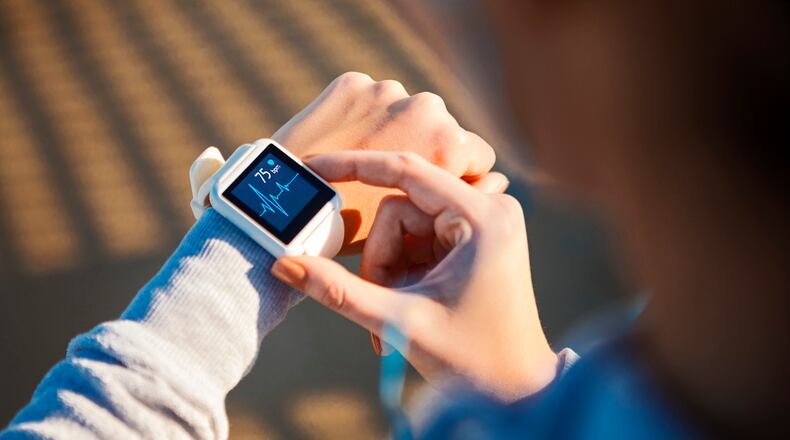 A smart watch or Fitbit wearables can help monitor your heart rate. iSTOCK/COX
