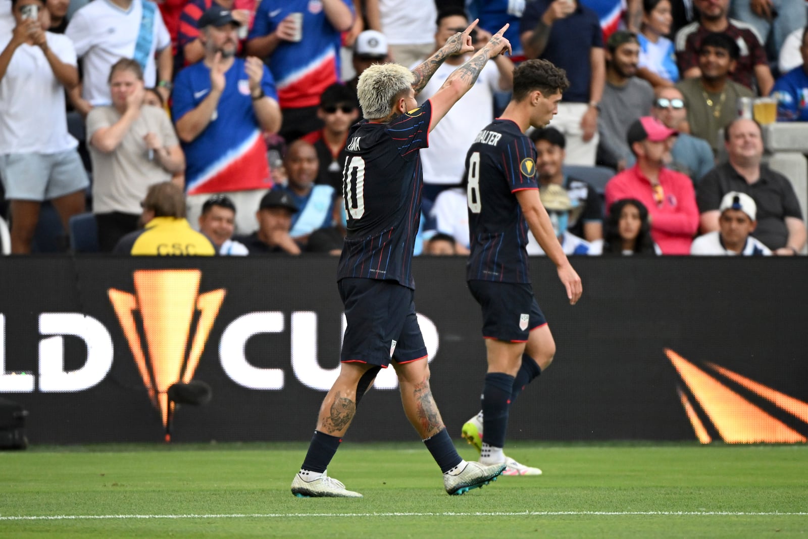 United States midfielder Diego Luna (10) reacts after scoring a goal against Guatemala during the first half of a CONCACAF Gold Cup semifinal soccer match, Wednesday, July 2, 2025, in St. Louis. (AP Photo/Connor Hamilton)