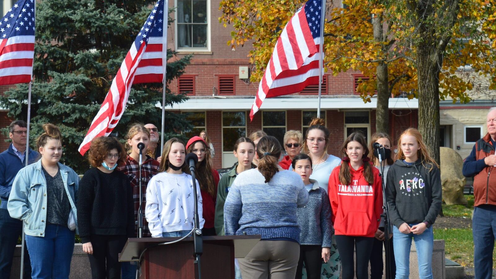 The National Anthem was sung at the Veterans Day ceremony in the Uptown park by the Talawanda Middle School Bel Canto Choir. CONTRIBUTED/BOB RATTERMAN