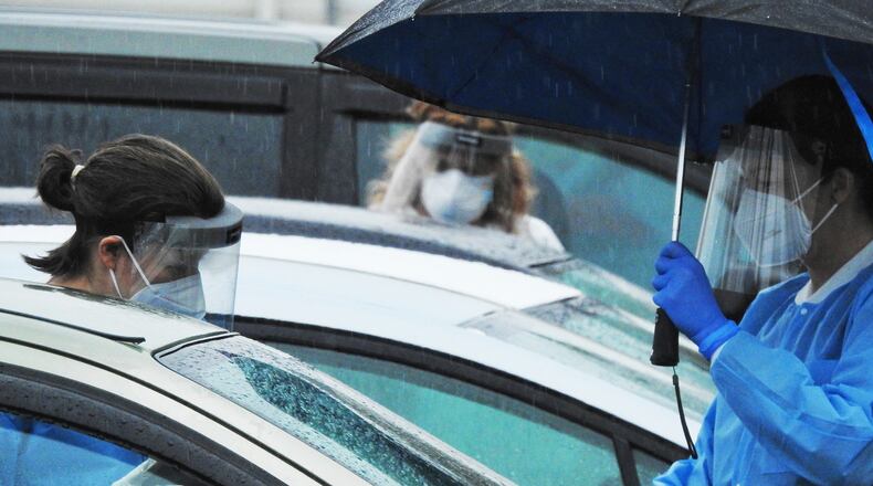 DNA Diagnostics Center conducting rapid COVID-19 testing in January 2021. The CDC estimates approximately 30% of people hospitalized for COVID-19, and approximately 13.3% of those who had COVID but were not hospitalized, have also dealt with long or chronic COVID after first catching the virus. NICK GRAHAM / STAFF FILE PHOTO