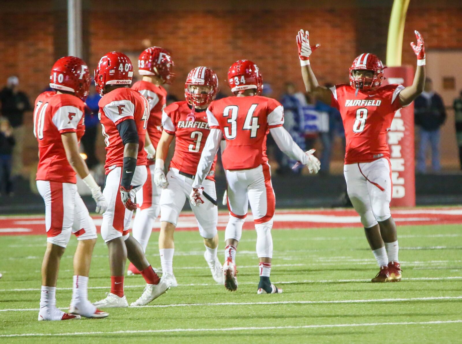 Fairfield running back James Mitchell (8) celebrates after returning a punt for a touchdown during a Division I playoff game against St. Xavier at Fairfield Stadium on Nov. 4, 2016. GREG LYNCH/STAFF