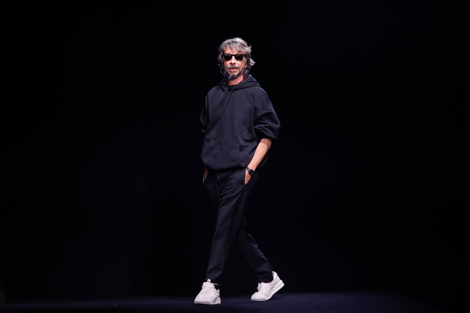 FILE - Designer Pierpaolo Piccioli accepts applause at the end of the Valentino Haute Couture Spring-Summer 2023 collection presented in Paris, Wednesday, Jan. 25, 2023. (AP Photo/Lewis Joly, File)