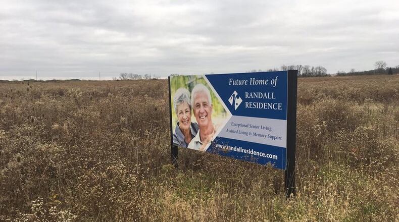 A Randall Residence will be part of a development planned in a rarmer farm property at Ohio 571 and Iddings Road in West Milton. This advertisement for the Randall Residence of Centerville sits near the intersection of Sheehan and West Social Row roads, at the former site of the Rabold Farm.