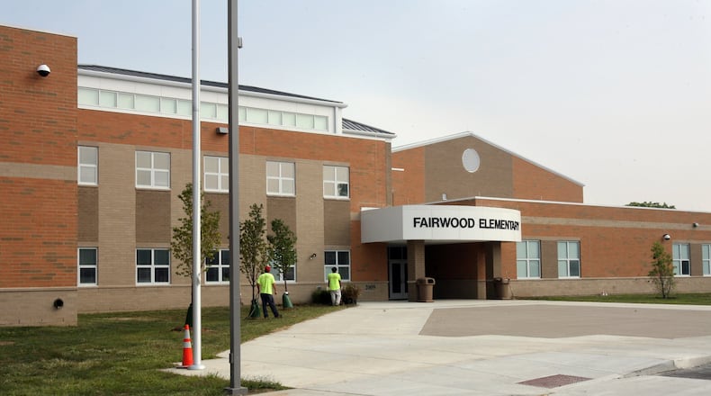 Workers put the finishing exterior touches on Hamilton Schools’ new Fairwood Elementary School just before its opening in 2009. This year marks the 10th anniversary of the city school system opening four new elementaries. Besides Fairwood, the district also opened Bridgeport, Linden and Ridgeway elementaries.