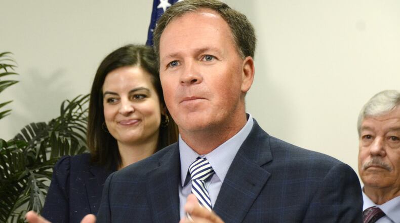 Butler County Auditor Roger Reynolds speaks on Monday about the bill Ohio Reps. Brigid Kelly, D-Cincinnati, and George Lang, R-West Chester Twp., introduced this month to address fuel quality standards in Ohio. Ohio is one of three states that do not test for fuel quality. MICHAEL D. PITMAN/STAFF