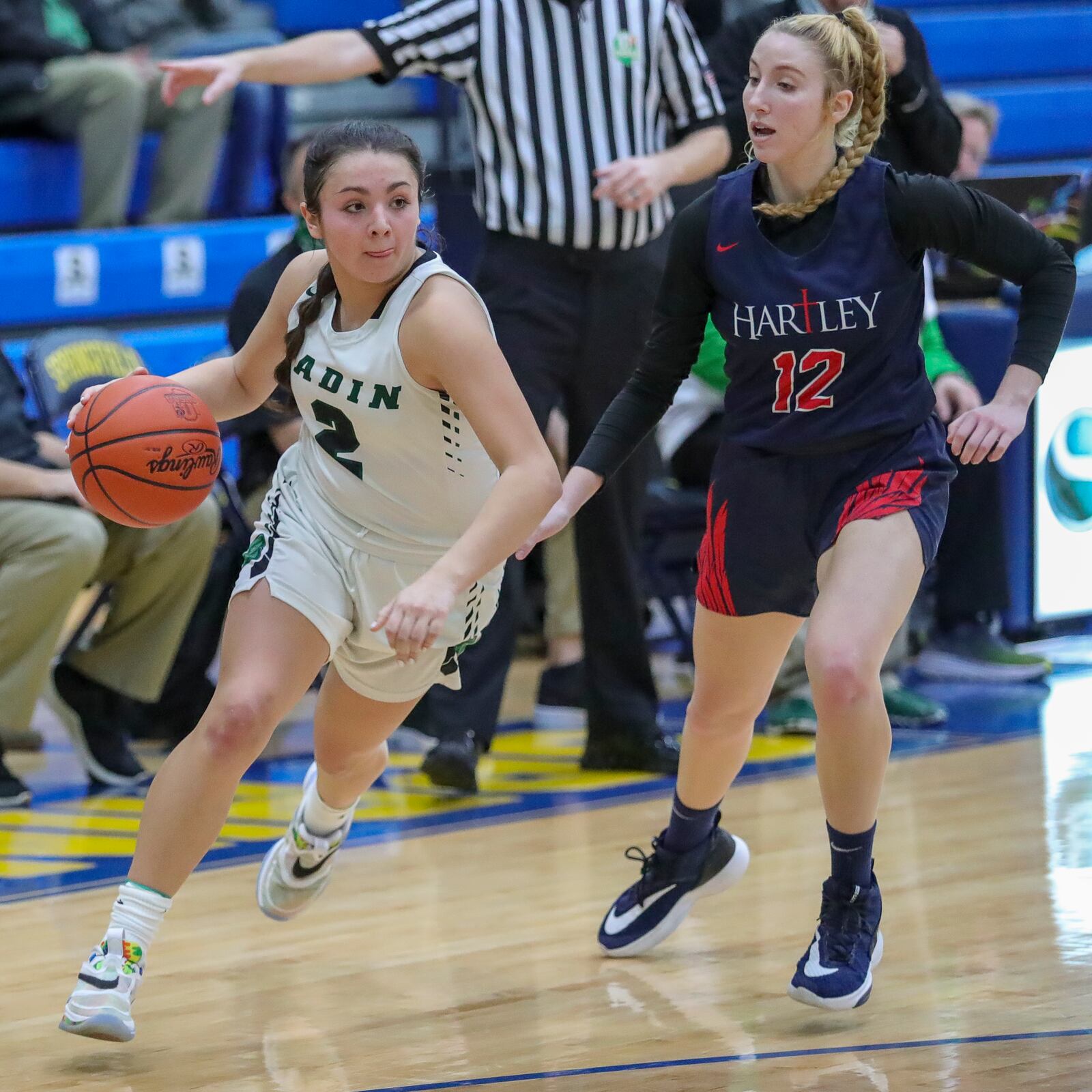 Badin's Mahya Lindesmith drives past Alexis Cashwell during a Division II regional semifinal vs. Columbus Bishop Hartley at Springfield High School on March 2, 2021. Michael Cooper/CONTRIBUTED