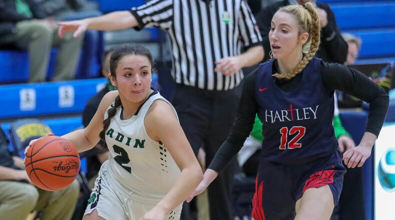 Badin's Mahya Lindesmith drives past Alexis Cashwell during a Division II regional semifinal vs. Columbus Bishop Hartley at Springfield High School on March 2, 2021. Michael Cooper/CONTRIBUTED