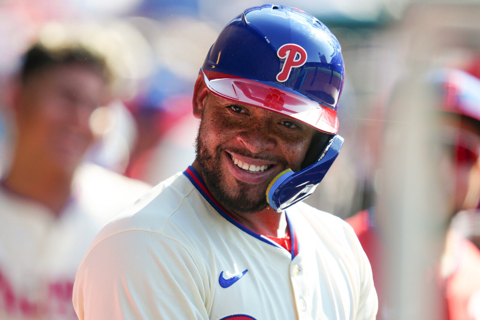 Philadelphia Phillies' Edmundo Sosa smiles in the dugout after hitting a solo home run off Cincinnati Reds pitcher Nick Lodolo during the fifth inning of a baseball game, Saturday, July 5, 2025, in Philadelphia. (AP Photo/Derik Hamilton)