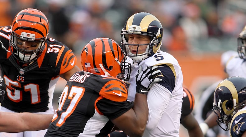 CINCINNATI, OH - NOVEMBER 29: Geno Atkins #97 of the Cincinnati Bengals hits Nick Foles #5 of the St. Louis Rams at Paul Brown Stadium on November 29, 2015 in Cincinnati, Ohio. (Photo by John Grieshop/Getty Images)