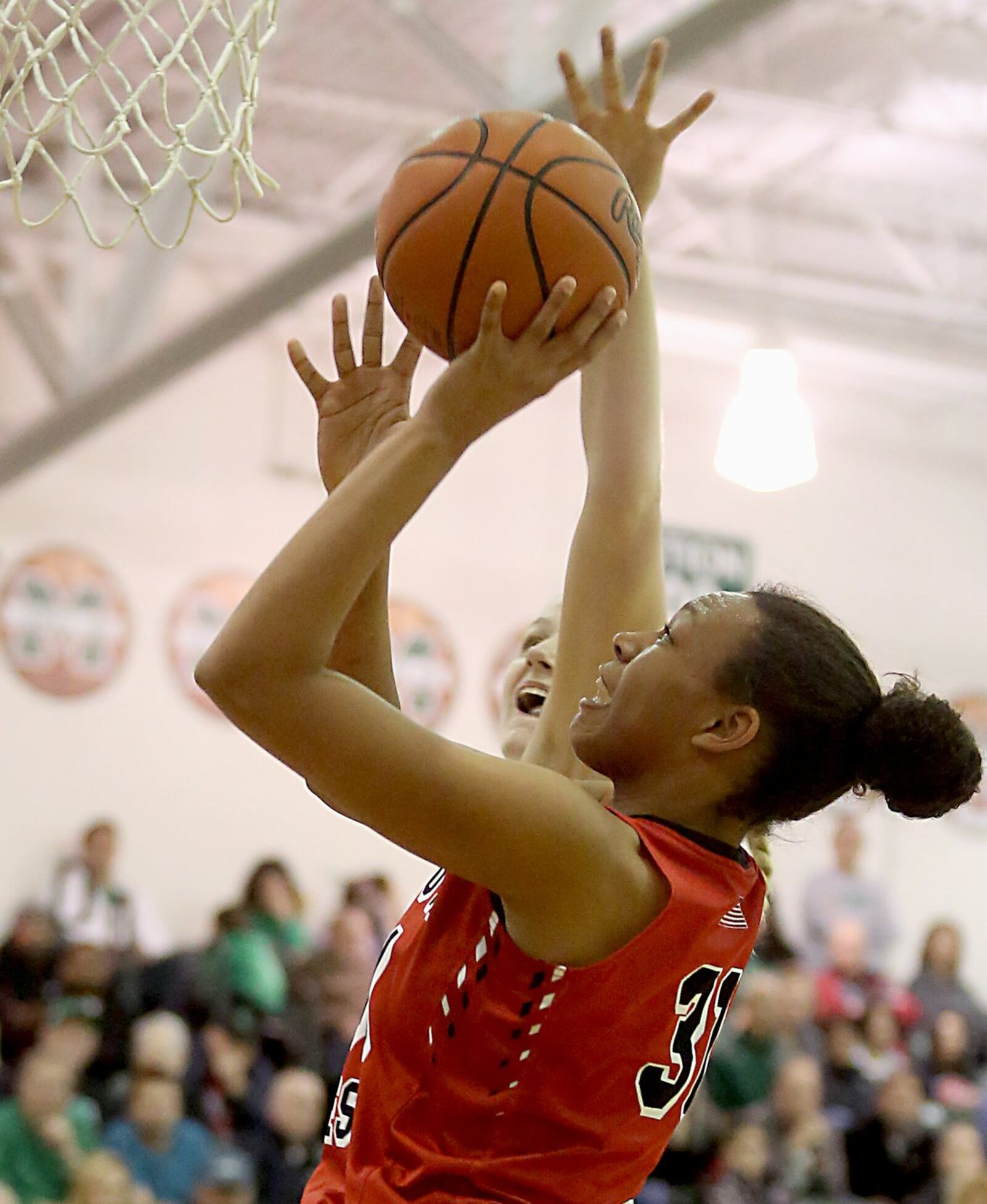 Lakota West’s Nevaeh Dean draws a foul from Mason’s Sammie Puisis on Saturday afternoon at the Mason Arena. CONTRIBUTED PHOTO BY E.L. HUBBARD