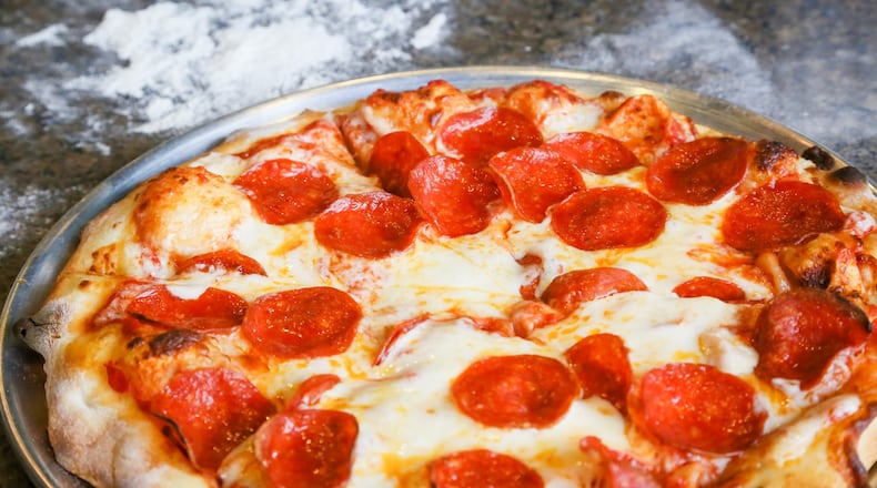 Pizza is being slung all over Cincinnati this week as $10 deals abound. FILE