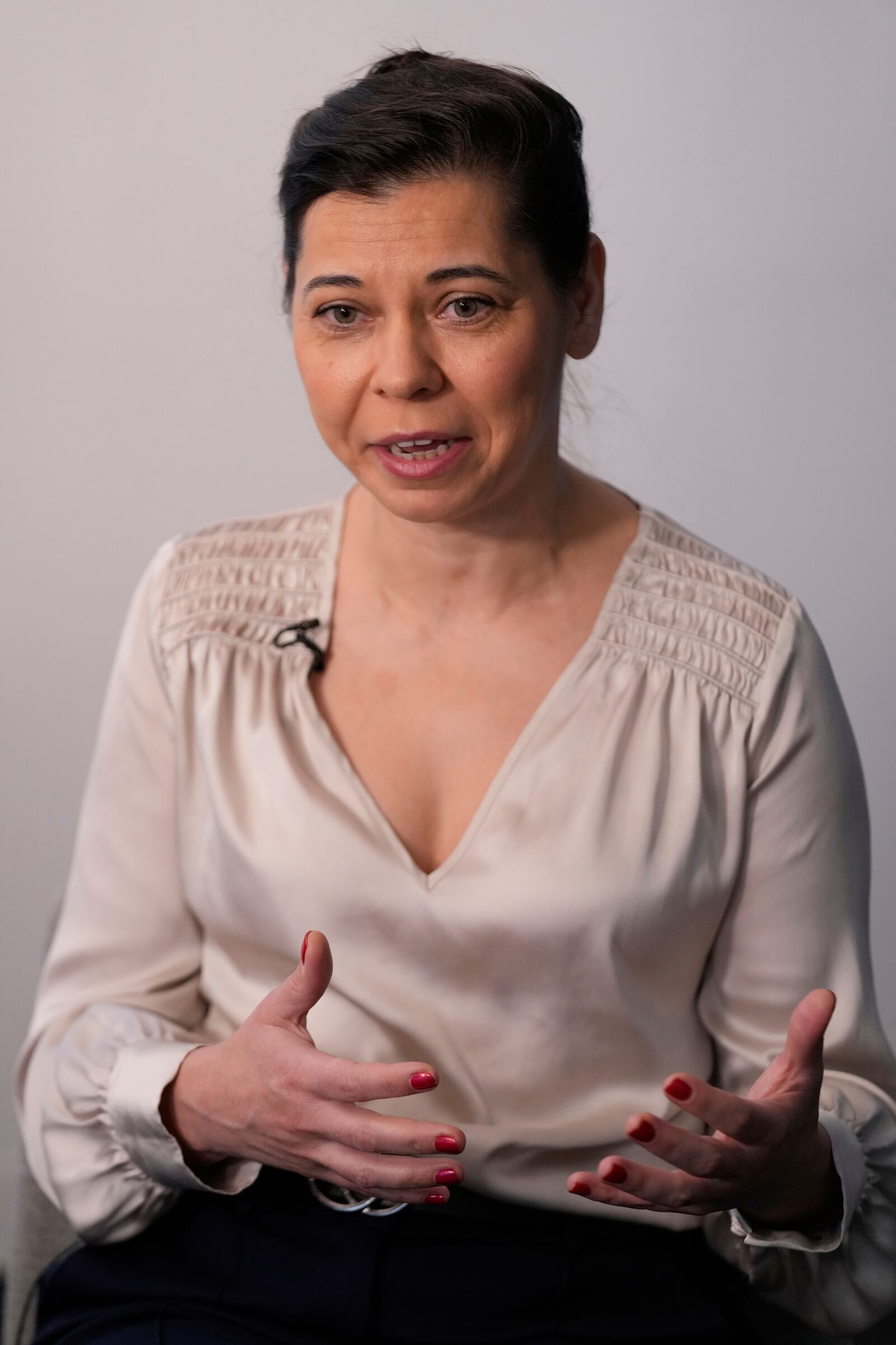 Dani Dumitriu talks to reporters at her office in New York, Thursday, March 20, 2025. (AP Photo/Seth Wenig)