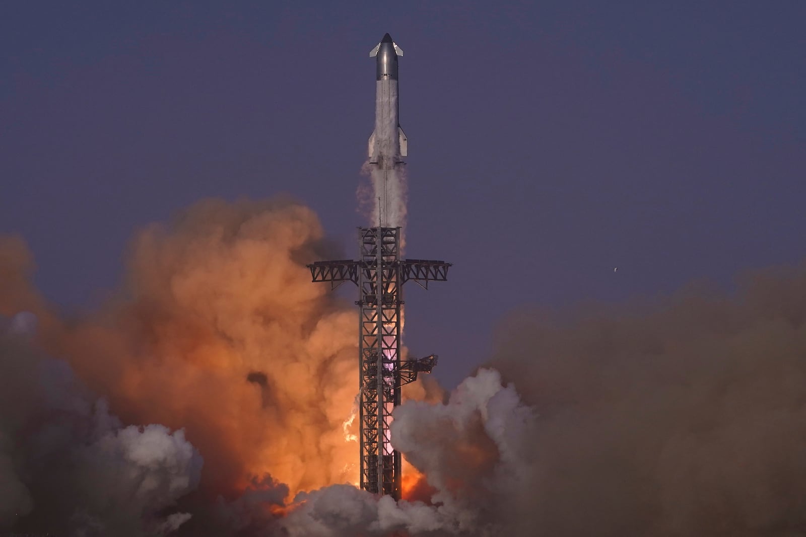 SpaceX's mega rocket Starship makes a test flight from Starbase, Texas, Tuesday, May 27, 2025. (AP Photo/Eric Gay)
