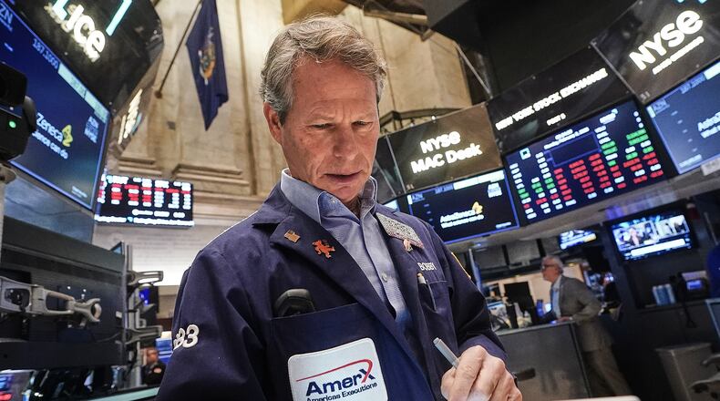 Trader Robert Charmak works on the floor of the New York Stock Exchange, Monday, Feb. 2, 2026. (AP Photo/Richard Drew)